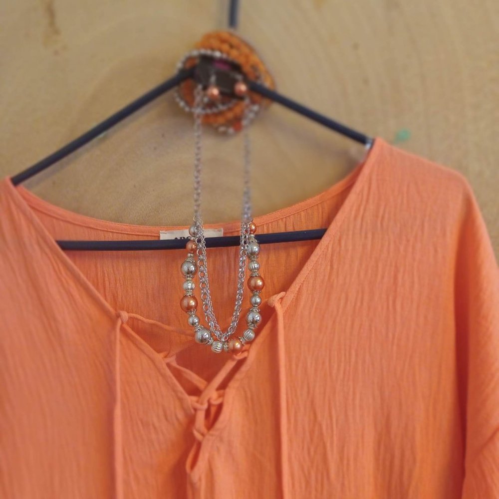 Orange romper with accessories